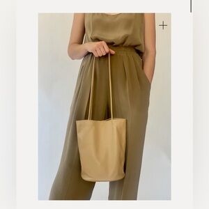 modern weaving drape oval bucket bag camel